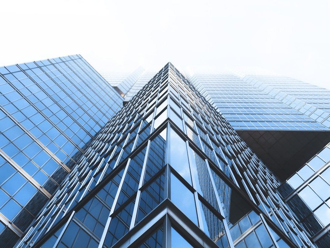 Modern glass office facades photographed from below
